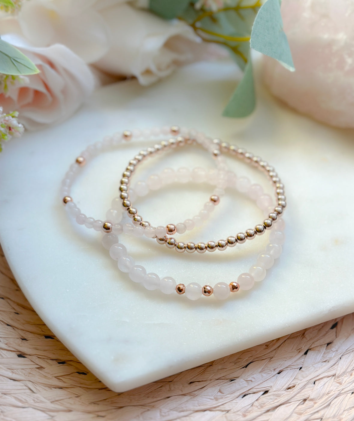 pink gemstone stacking bracelet set with rose quartz, rhodonite, pink zebra jasper and a rose gold heart charm