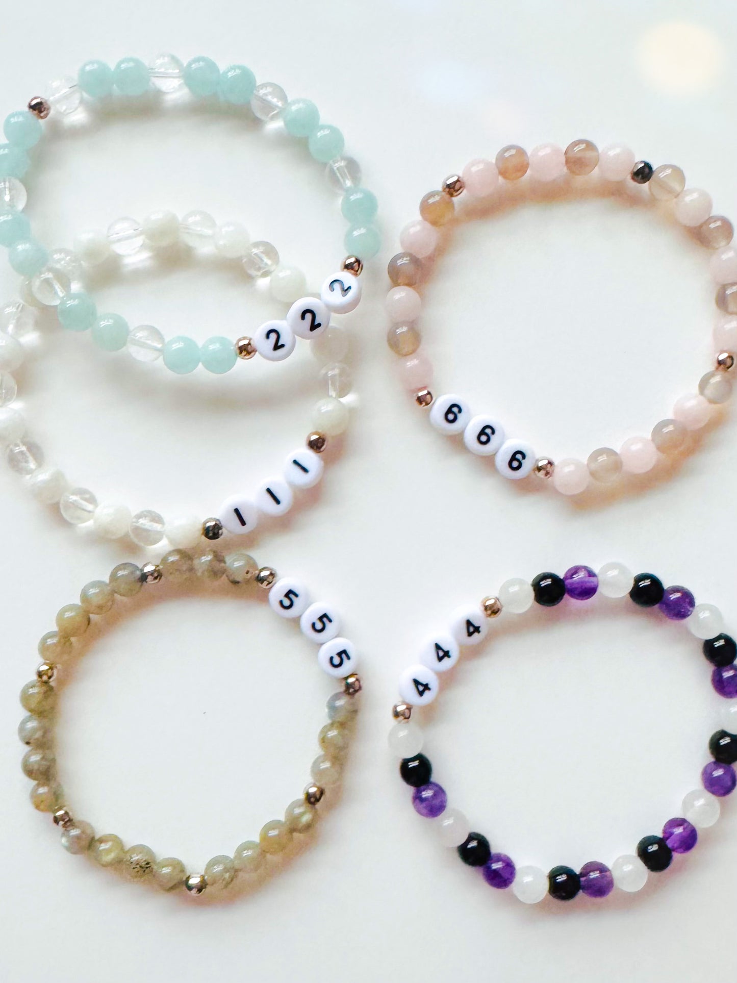 A collection of Angel Number Healing Bracelets, designed to symbolize spiritual guidance and reassurance. Each bracelet represents a unique angel number, offering messages of alignment, protection, and divine support.