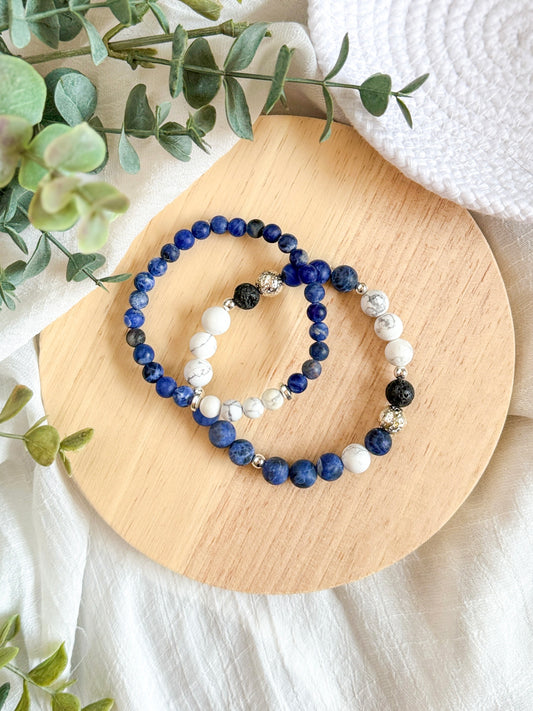 A gemstone bracelet set designed for balance and tranquility, featuring Sodalite to ease stress, promote inner peace, and support self-expression. Howlite enhances the calming effects by reducing tension and soothing the mind. The set also includes 4mm Silver Hematite for grounding, mental strength, negativity protection, and EMF shielding. Worn together, these stones encourage harmony, protection, and deep calm.