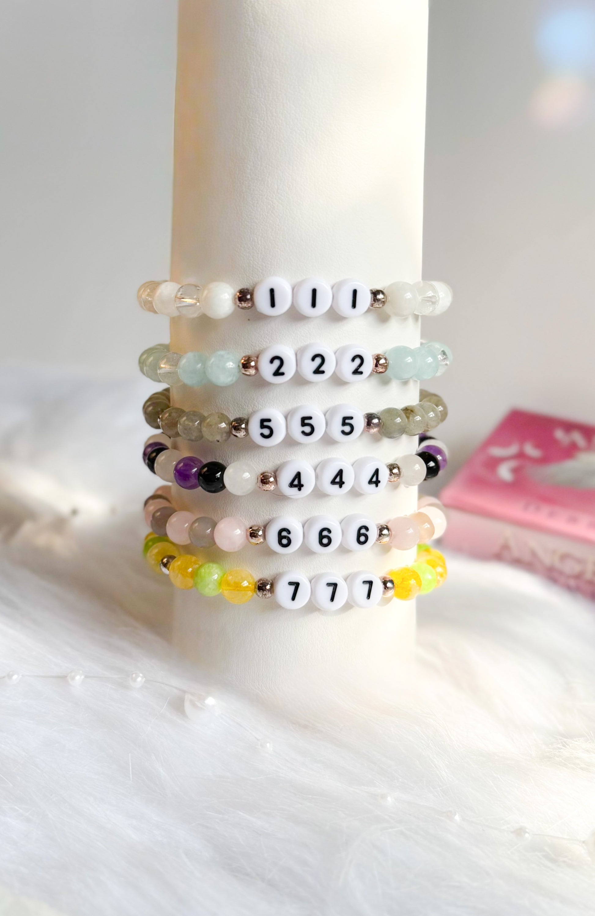 A collection of Angel Number Healing Bracelets, designed to symbolize spiritual guidance and reassurance. Each bracelet represents a unique angel number, offering messages of alignment, protection, and divine support.