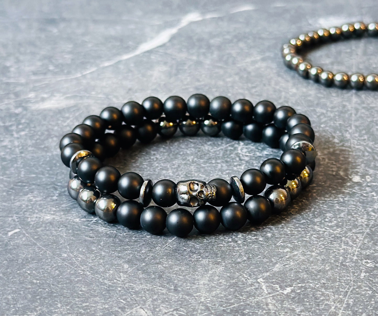 mens gemstone bracelets made with Matte Onyx, Hematite and a skull bead