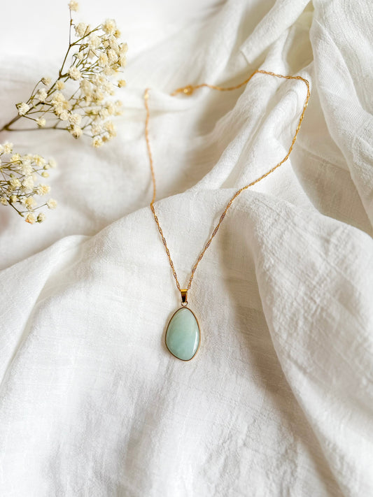 Handcrafted Amazonite necklace inspired by Rumi’s quote ‘You are not a drop in the ocean. You are the entire ocean, in a drop.’ Features calming blue-green Amazonite beads, evoking grounding, flow, and inner strength. Styled as a cozy, autumn-inspired piece symbolizing peace and depth.