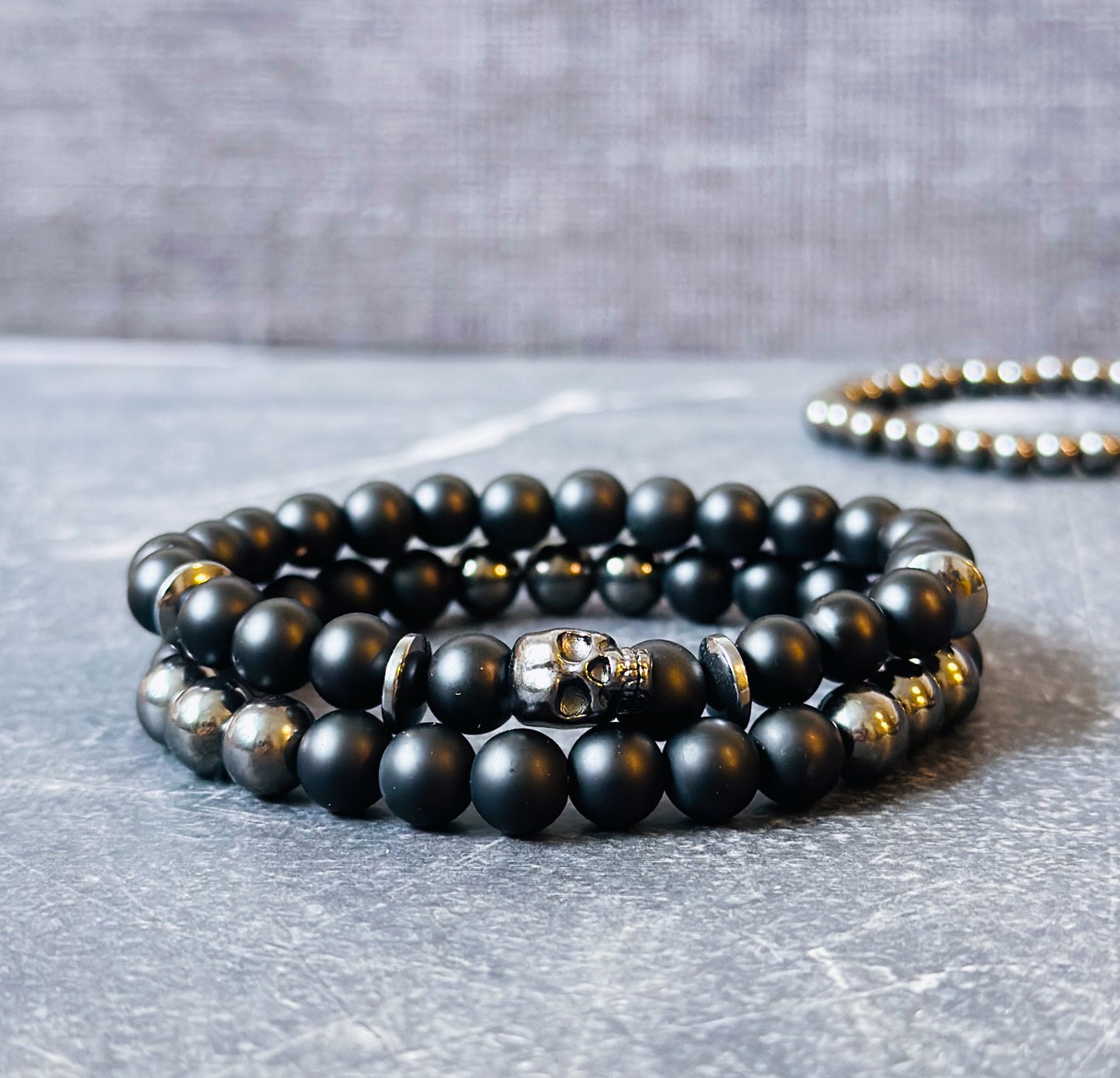 mens gemstone bracelets made with Matte Onyx, Hematite and a skull bead