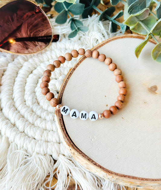 Introducing the Natural Mama Bracelet, a harmonious blend of 6mm Rosewood and Hematite beads, thoughtfully designed to embody both style and holistic healing.