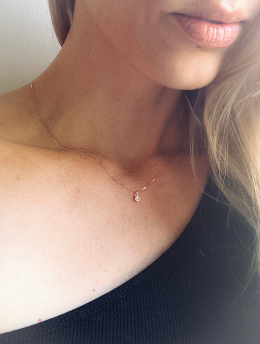 dainty sterling silver rose gold plated necklace, adorned with sterling silver rose gold-plated Opalite gemstone charm. Crafted to perfection, this necklace embodies elegance. The delicate sterling silver rose gold plated chain complements the intricate Opalite gemstone charm.