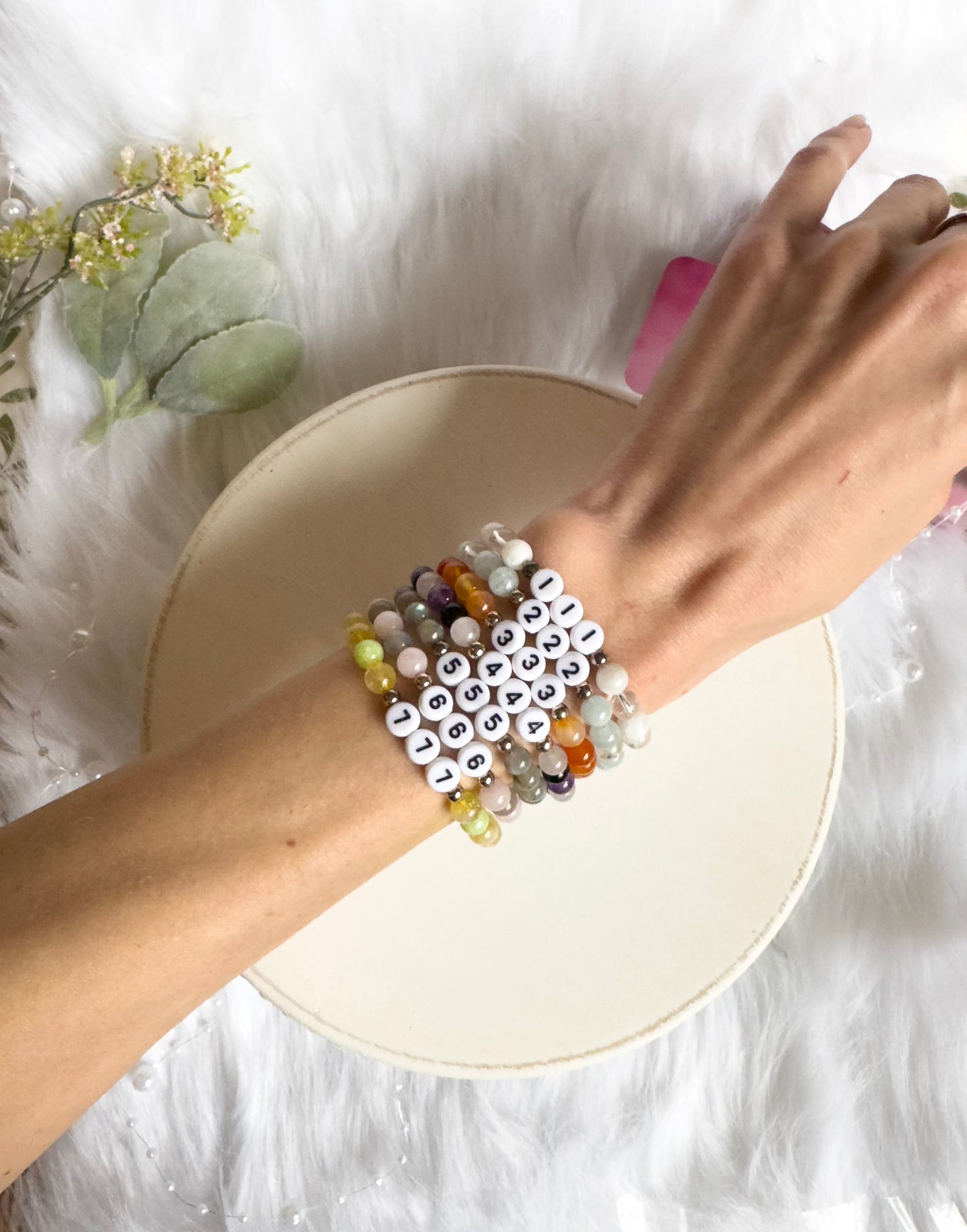 A collection of Angel Number Healing Bracelets, designed to symbolize spiritual guidance and reassurance. Each bracelet represents a unique angel number, offering messages of alignment, protection, and divine support.