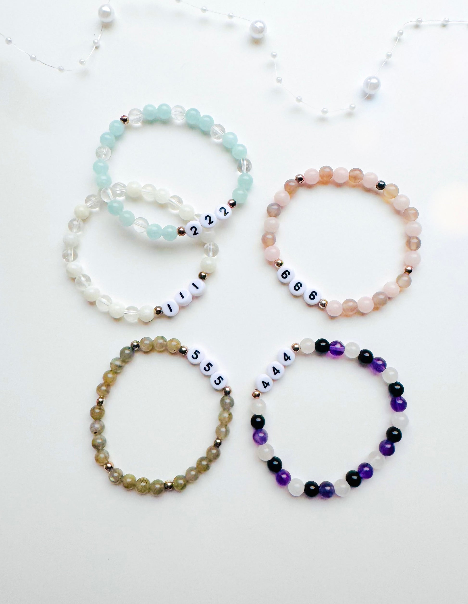A collection of Angel Number Healing Bracelets, designed to symbolize spiritual guidance and reassurance. Each bracelet represents a unique angel number, offering messages of alignment, protection, and divine support.