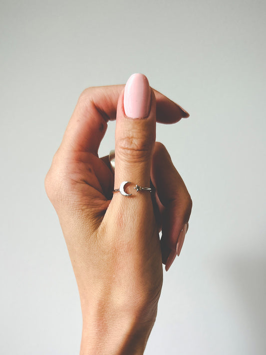 sterling silver ring with a cresent moon and star