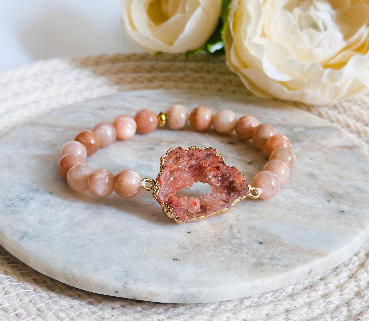 gemstone bracelet created with Sunstone Beads and a Peach Druzy Agate connector