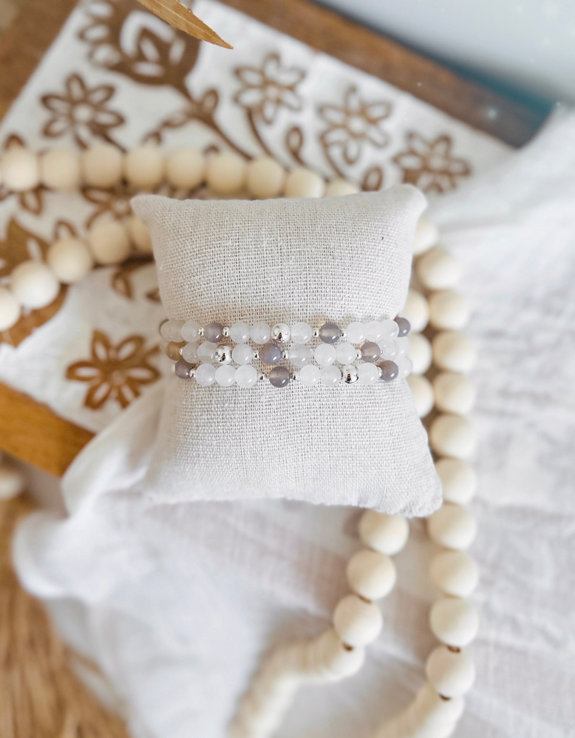 Discover the ethereal beauty of our Gemstone Bracelet Sets.  Choose between The "Glacial Grace" set, adorned with Aquamarine that enchants you with its calming aura and promotes clarity, or the "Polar Elegance" set featuring White Jade that radiates purity and harmony.