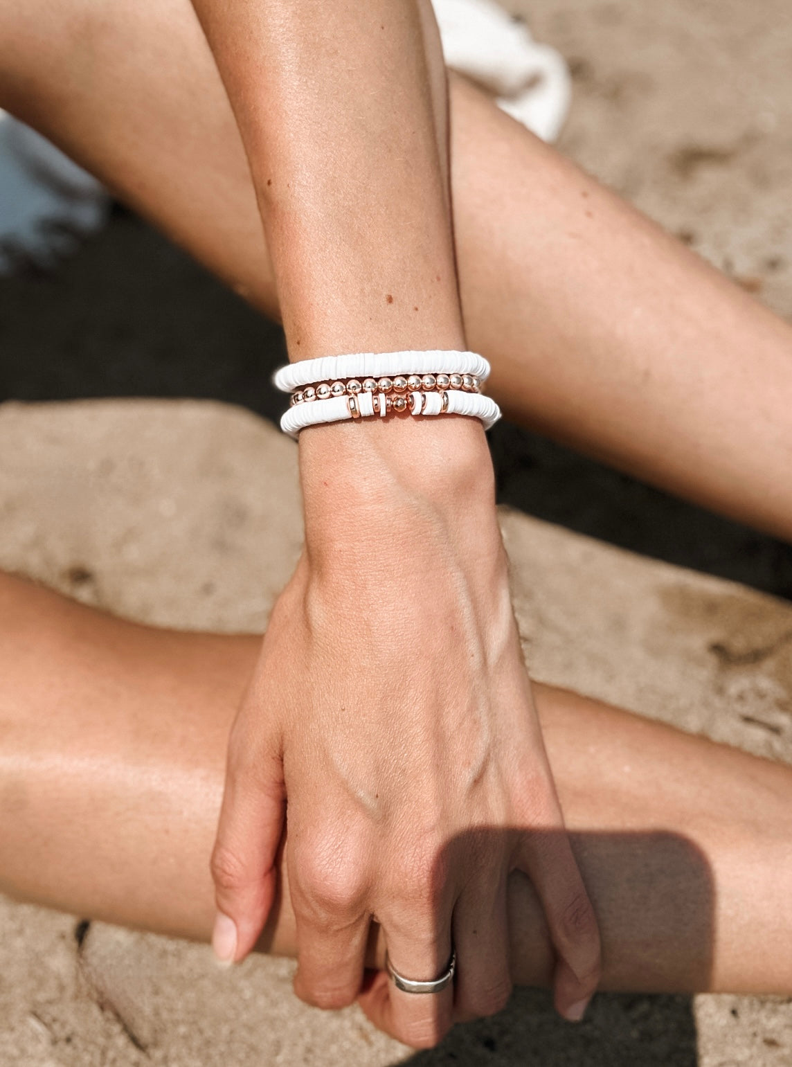 Introducing The Naya Bracelets, a beautiful collection crafted from white polymer clay heishi beads. These bracelets seamlessly blend style and wellness, making them an ideal accessory for any occasion.