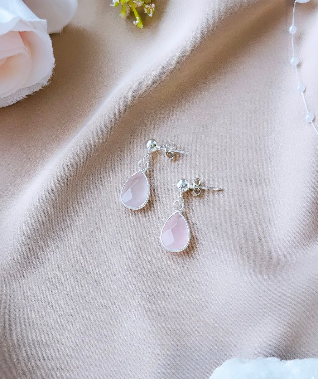 Elevate your style with the Bella Earrings, featuring exquisite Sterling Silver craftsmanship and adorned with Rose Quartz droplet gemstones.
