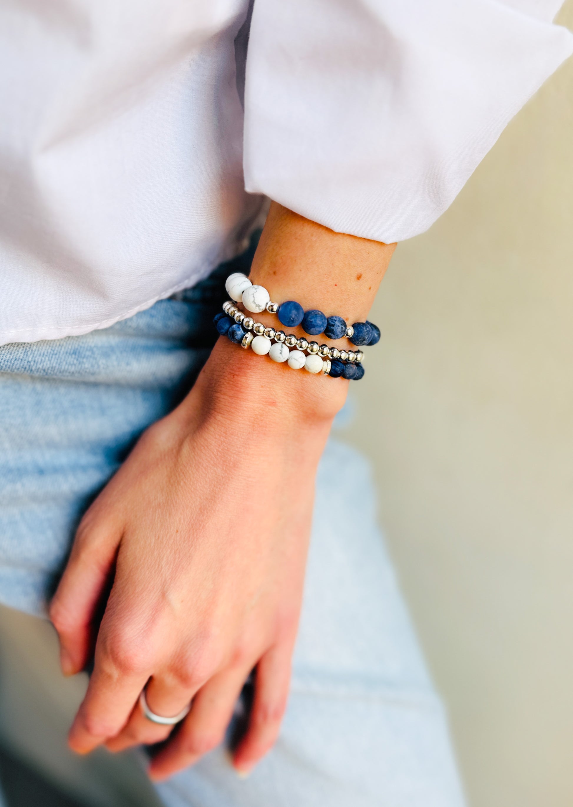 A gemstone bracelet set designed for balance and tranquility, featuring Sodalite to ease stress, promote inner peace, and support self-expression. Howlite enhances the calming effects by reducing tension and soothing the mind. The set also includes 4mm Silver Hematite for grounding, mental strength, negativity protection, and EMF shielding. Worn together, these stones encourage harmony, protection, and deep calm.