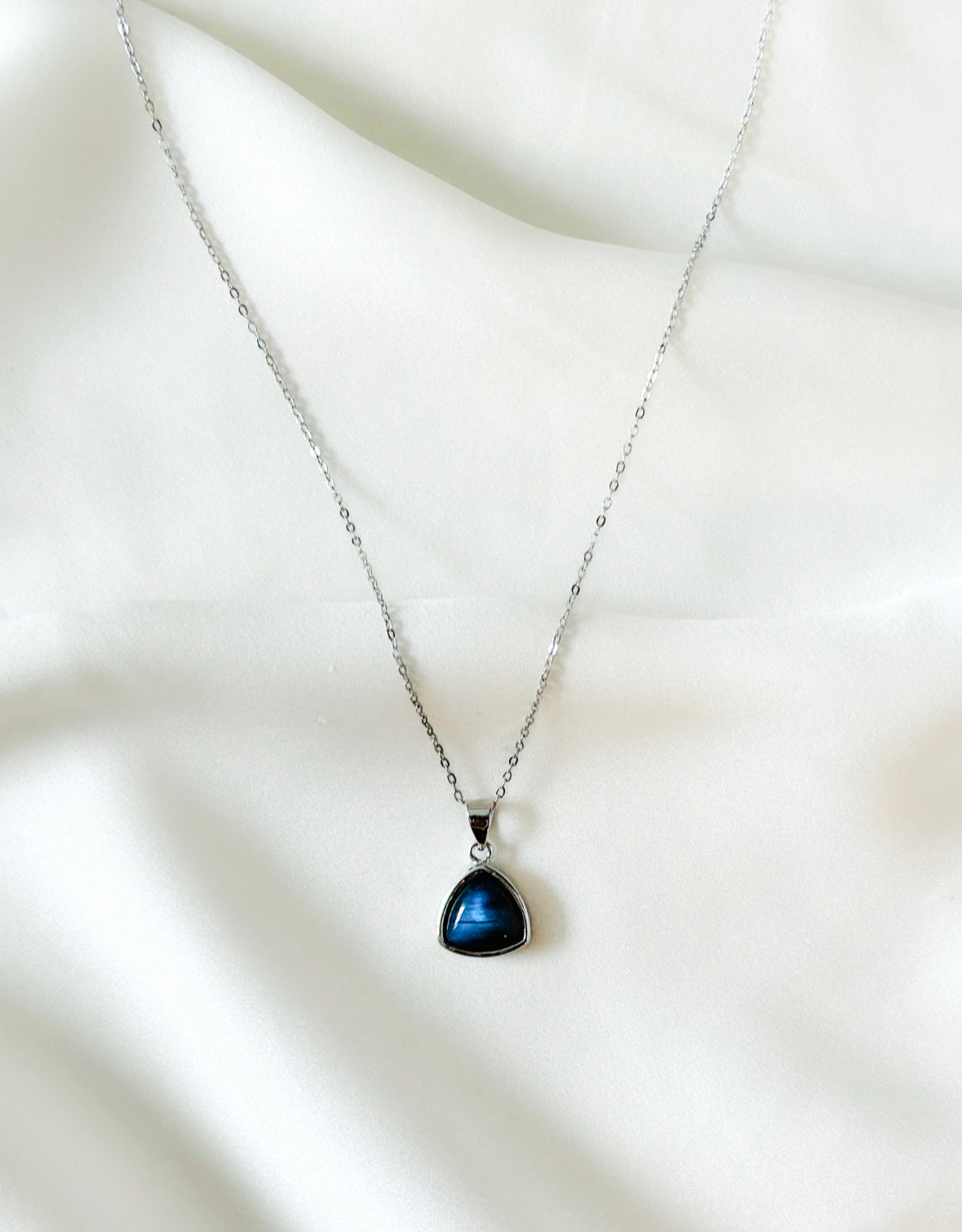 sterling silver necklace adorned with a captivating Labradorite charm.