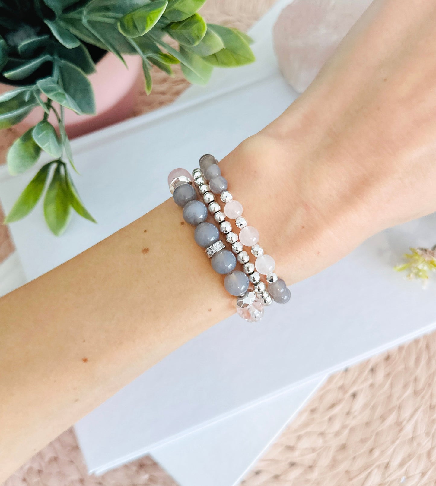 Introducing the "Velvet Rose" gemstone bracelet set, a sublime fusion of gray agate and rose quartz with captivating healing properties. The graceful gray agate, embodying stability and balance, harmonizes seamlessly with the tender energy of rose quartz, the "Stone of Unconditional Love."