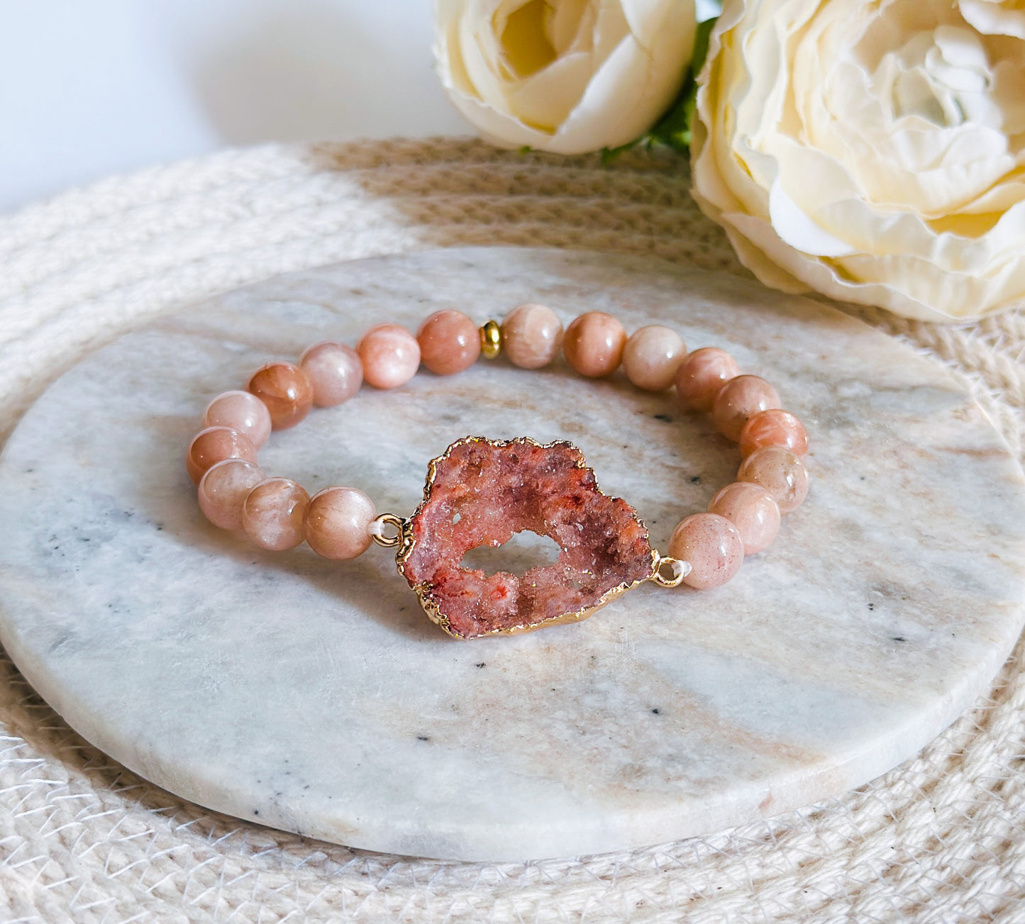 gemstone bracelet created with Sunstone Beads and a Peach Druzy Agate connector