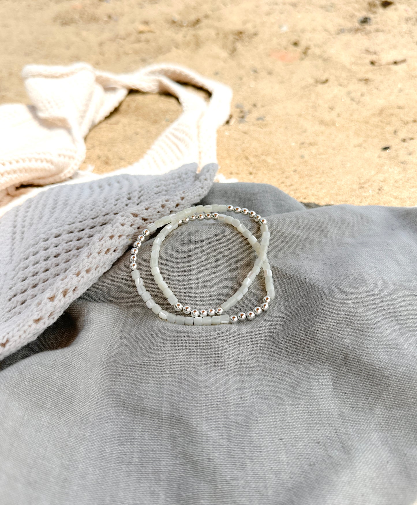 Introducing The Malia Double Wrap Bracelet, a captivating blend of elegance and healing energy. This exquisite bracelet features lustrous Mother of Pearl shell beads, known for their calming and nurturing properties. Each bead reflects a spectrum of iridescent hues, evoking the tranquil beauty of the ocean.