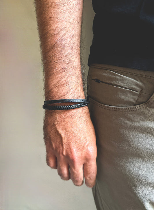 Introducing the Nomad Leather Bracelet – a statement piece for the modern man who values style and adventure. This double-strand leather bracelet combines durability and sophistication, making it the perfect accessory for any occasion.  **Leather**: Premium leather chosen for its durability and refined texture.