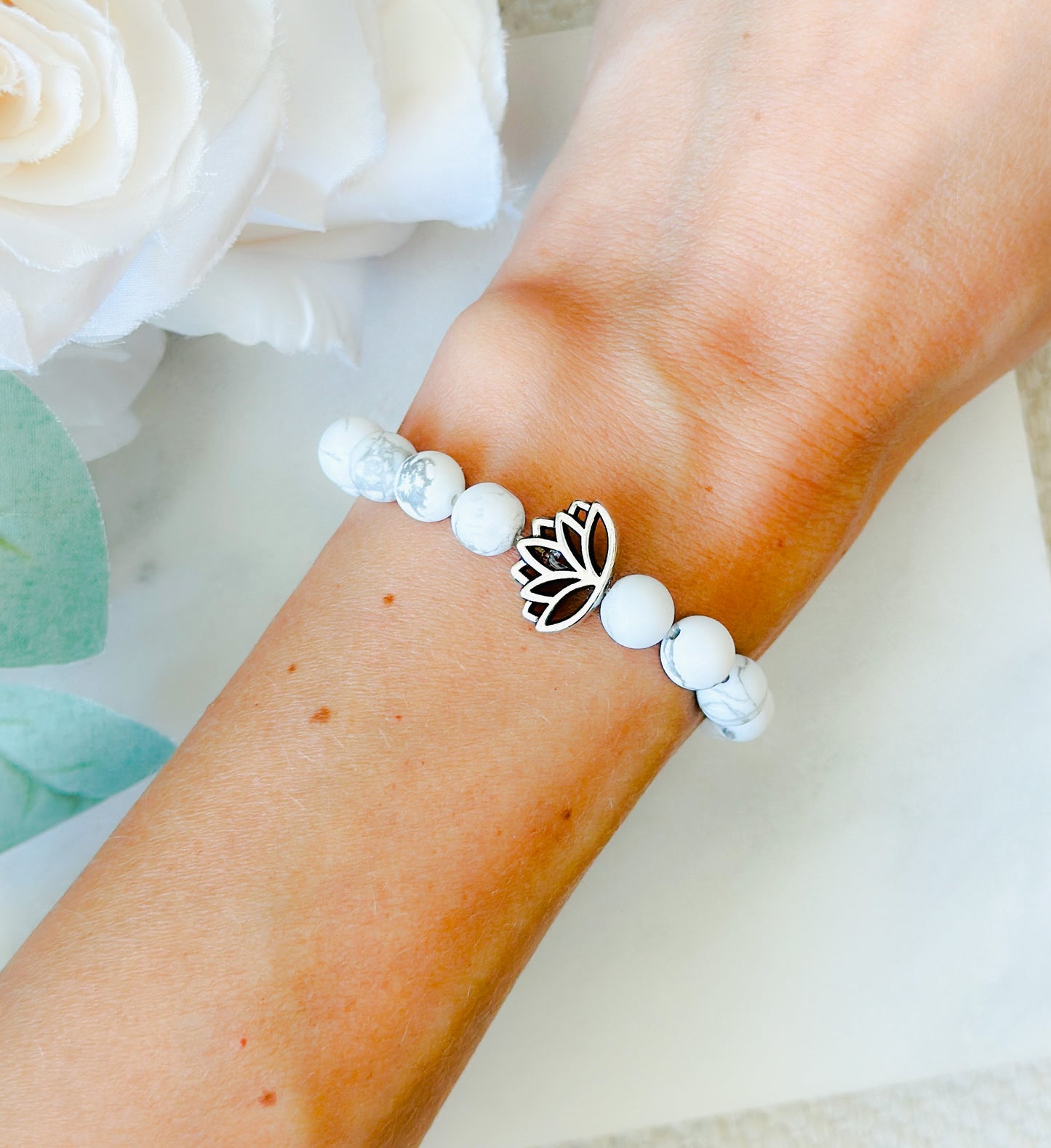Howlite gemstone bracelet with a lotus bead