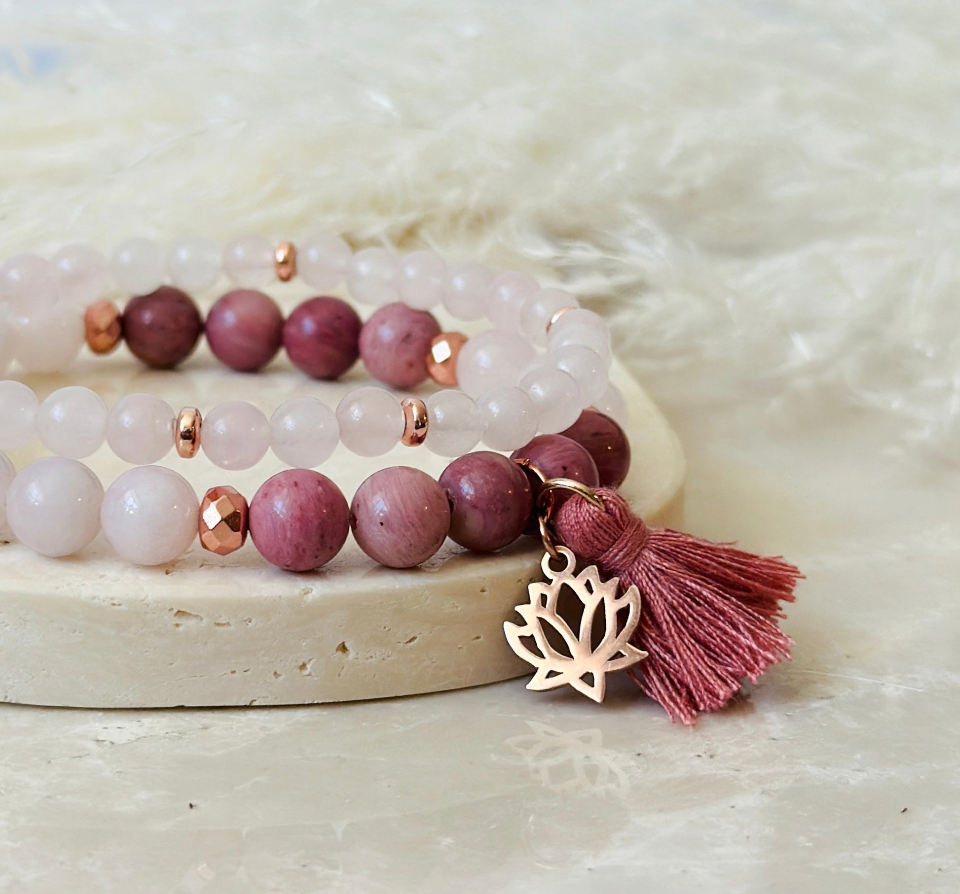 Introducing our exquisite gemstone bracelet set, thoughtfully crafted with Rhodonite and Rose Quartz, harnessing their incredible healing properties. Rhodonite, with its striking pink hues, is known for promoting emotional balance, compassion, and inner growth, making it a perfect companion for self-love and emotional healing. Paired with Rose Quartz, the universal stone of love, this set radiates unconditional love, compassion, and harmony, fostering emotional well-being and nurturing the heart.