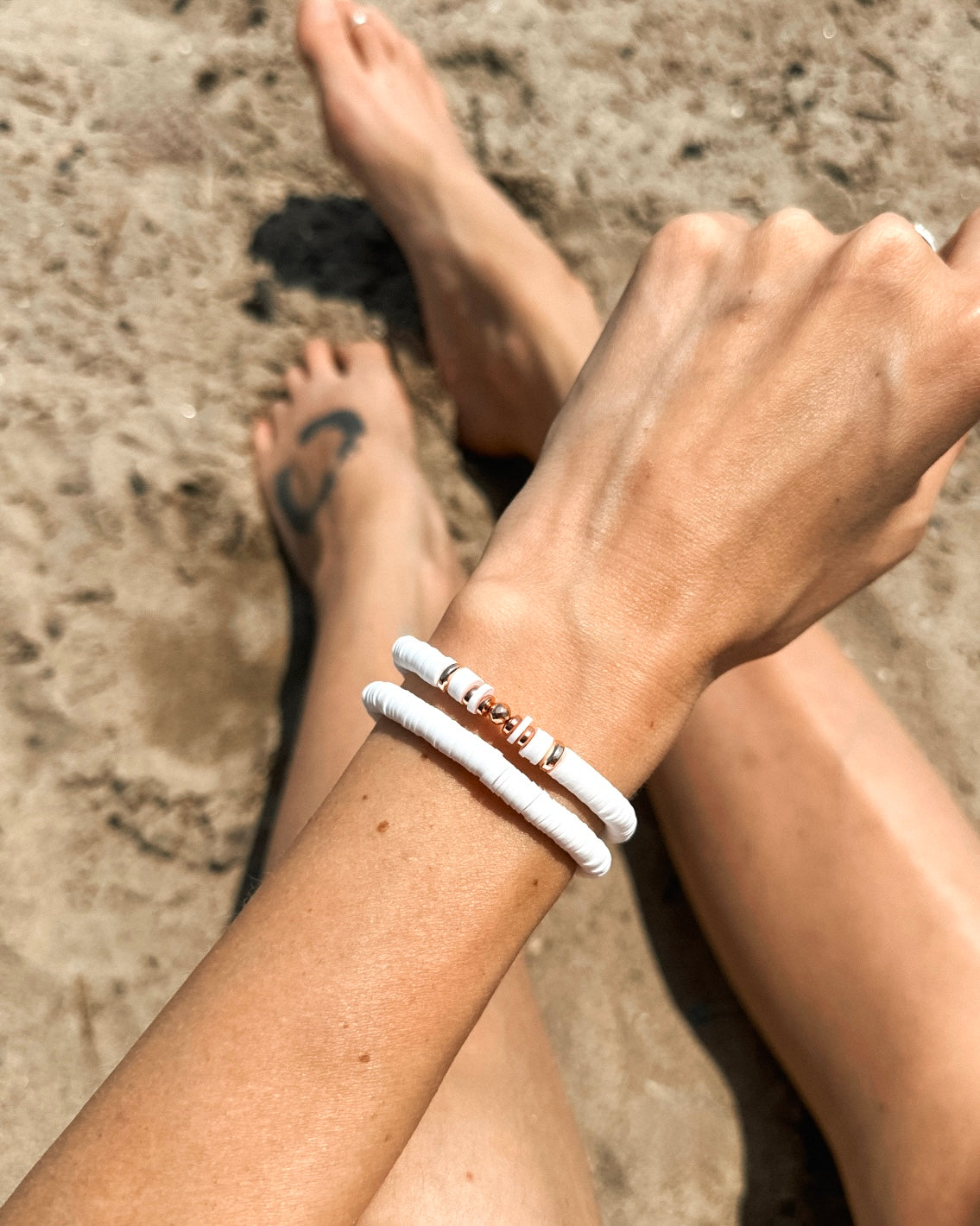 Introducing The Naya Bracelets, a beautiful collection crafted from white polymer clay heishi beads. These bracelets seamlessly blend style and wellness, making them an ideal accessory for any occasion.