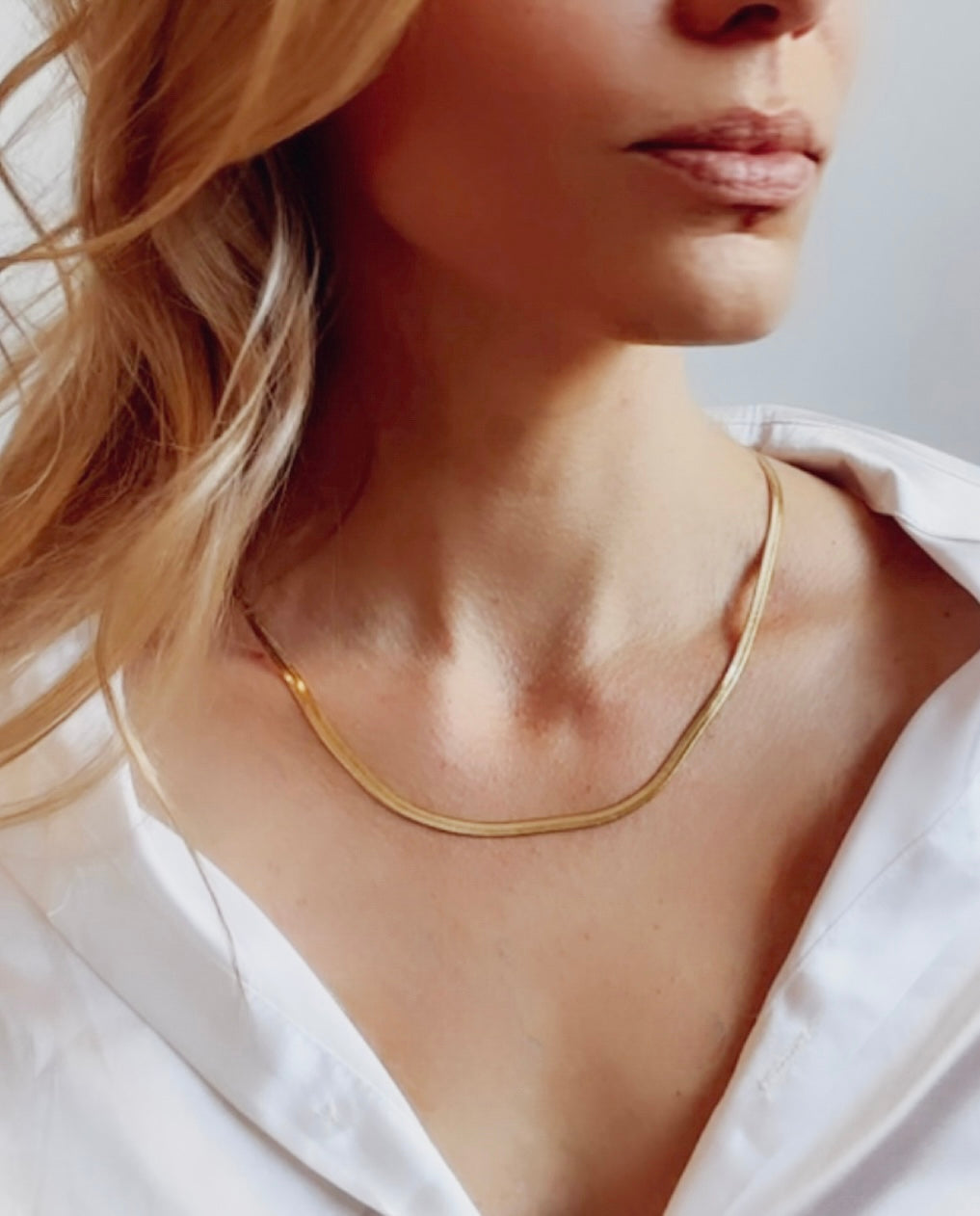 Introducing the Chloe Necklace, a stunning herringbone design meticulously crafted in your choice of sterling silver or elegantly plated with 18k gold. 