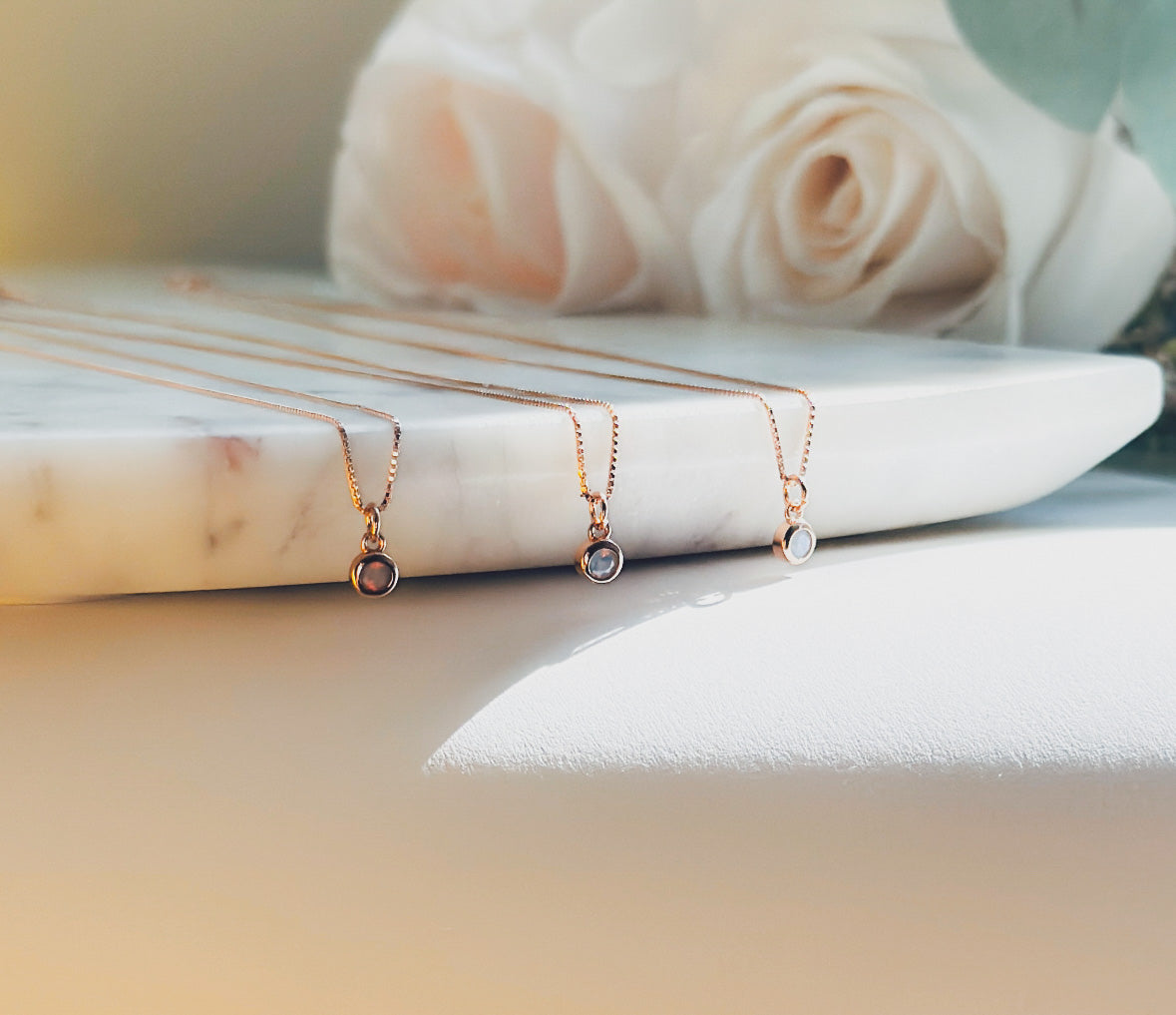 dainty sterling silver rose gold plated necklace, adorned with sterling silver rose gold-plated Opalite gemstone charm. Crafted to perfection, this necklace embodies elegance. The delicate sterling silver rose gold plated chain complements the intricate Opalite gemstone charm. 