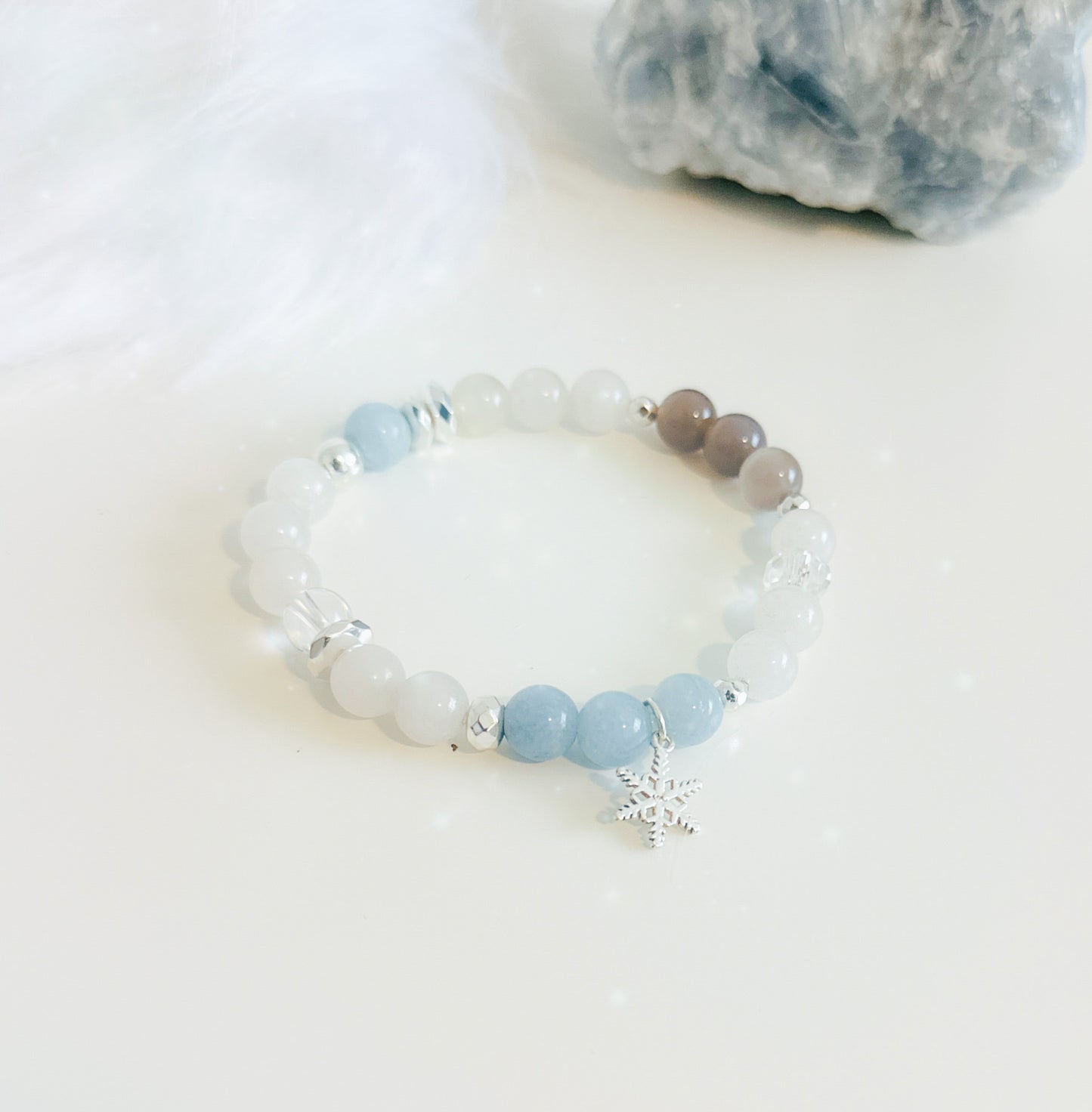 Snowflake Gemstone Bracelet Set, meticulously crafted with Aquamarine, White Jade, and a sterling silver snowflake charm. ❄️