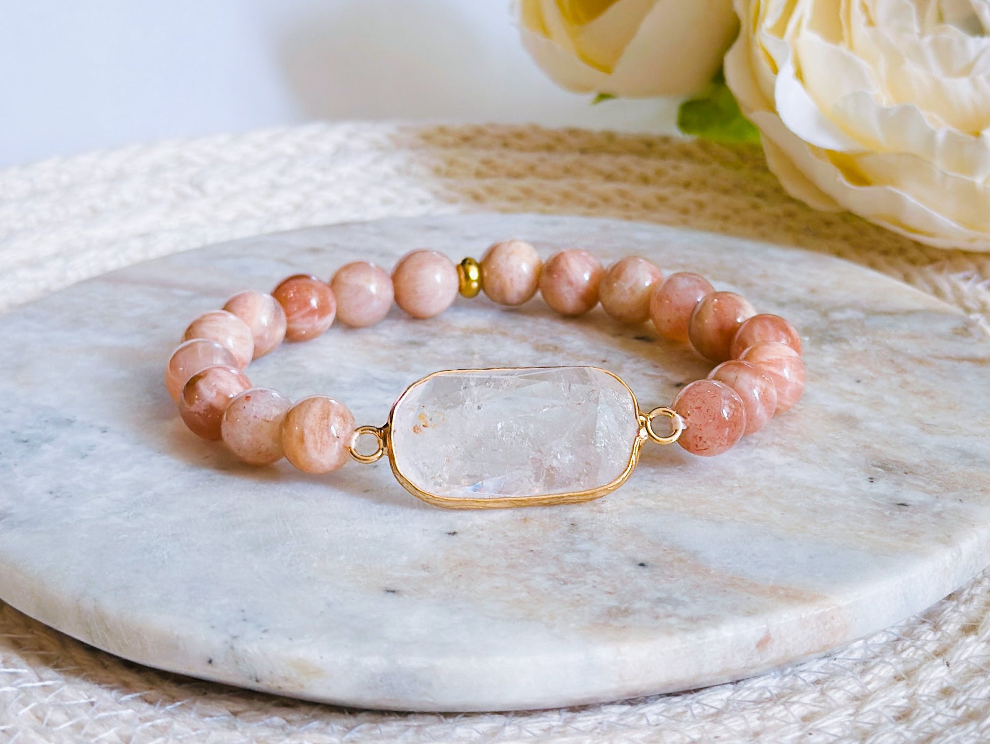 gemstone bracelet created with Sunstone Beads and a Clear Quartz  connector