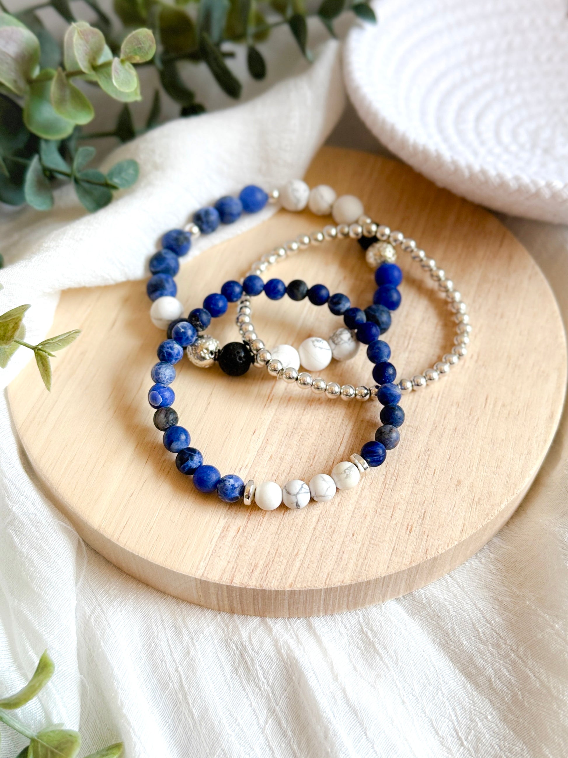 A gemstone bracelet set designed for balance and tranquility, featuring Sodalite to ease stress, promote inner peace, and support self-expression. Howlite enhances the calming effects by reducing tension and soothing the mind. The set also includes 4mm Silver Hematite for grounding, mental strength, negativity protection, and EMF shielding. Worn together, these stones encourage harmony, protection, and deep calm.