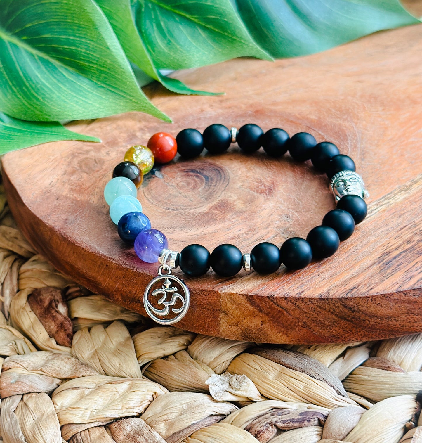 Gemstone bracelet Created with Matte Onyx and Chakra gemstones and a Om charm 
