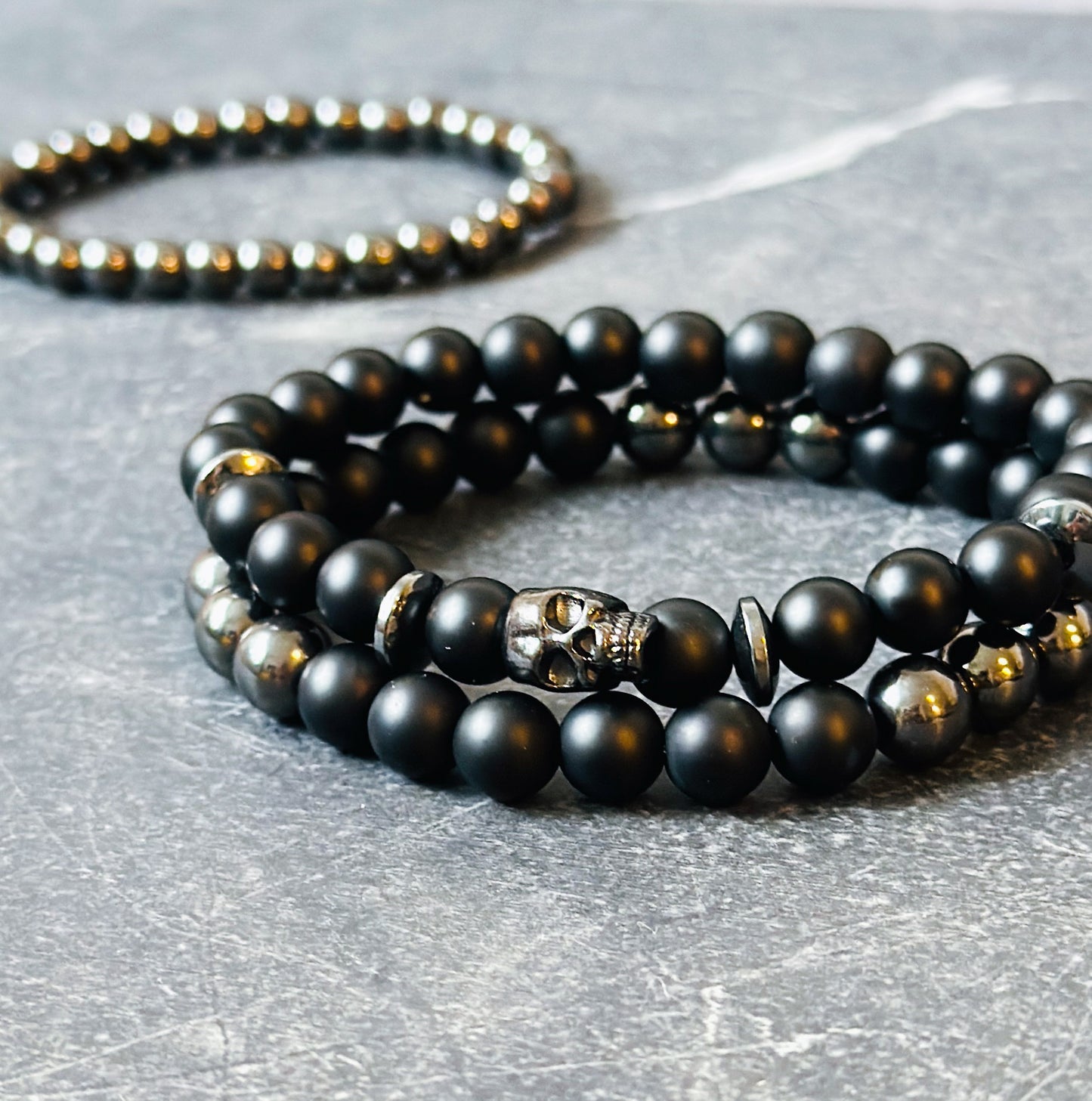 mens gemstone bracelets made with Matte Onyx, Hematite and a skull bead 