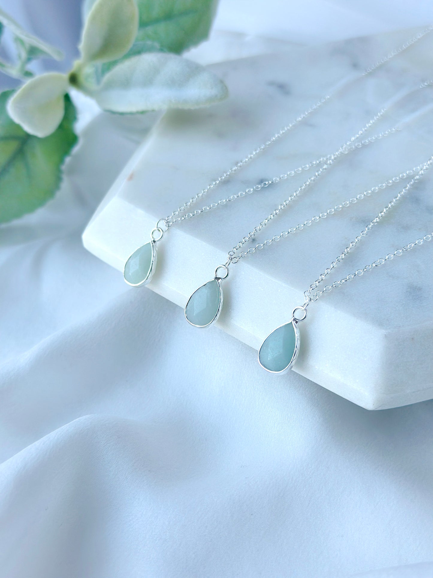 Introducing the Baya Necklace: A sterling silver pendant necklace adorned with a captivating Aquamarine gemstone.