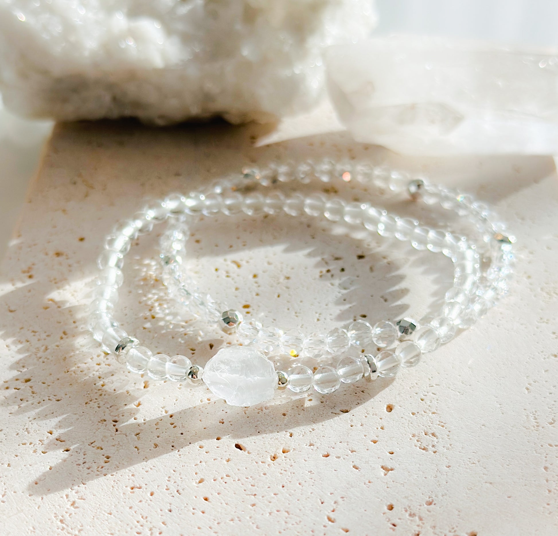 Introducing our 'Crystal Clarity Bracelet Set,' meticulously crafted with the pure energies of 4mm Clear Quartz beads and a striking Clear Quartz cluster focal bead.