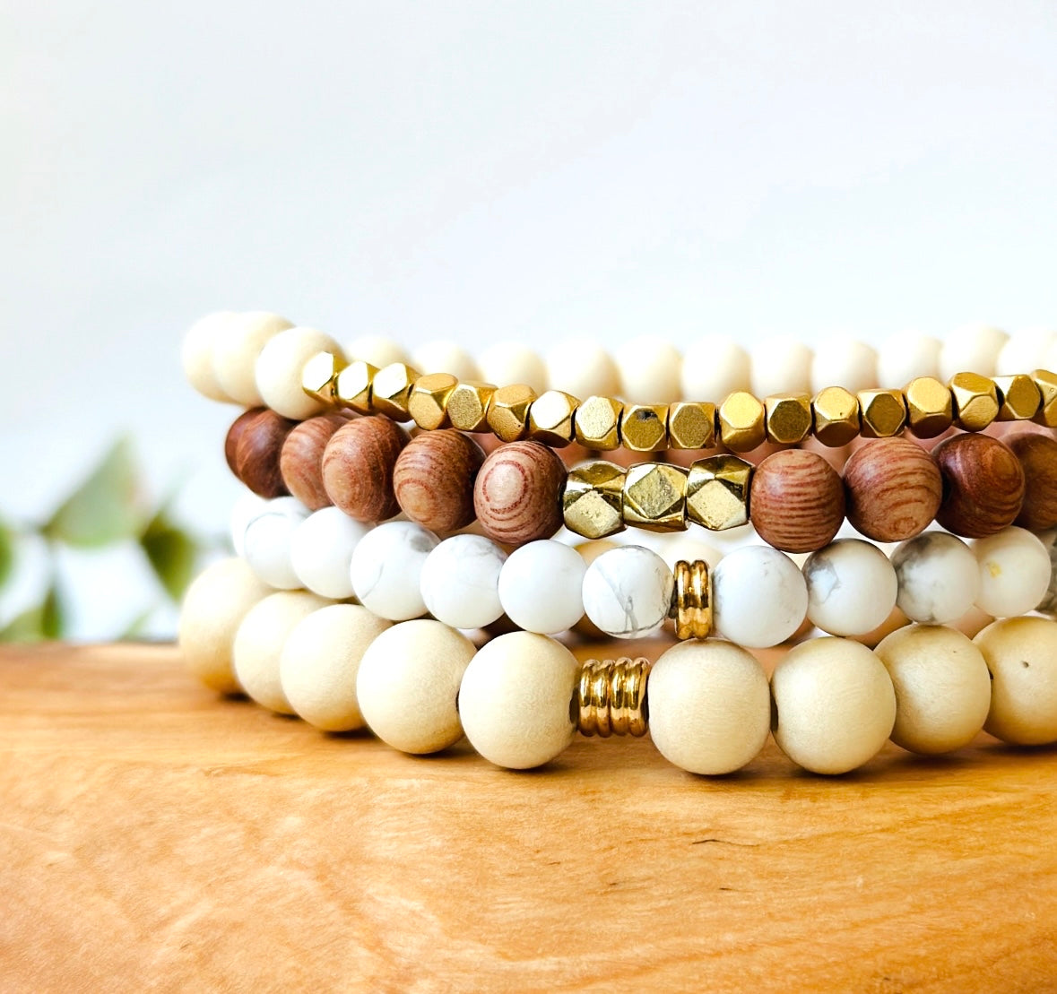 gemstone bracelet stacking set with whitewood, howlite, rosewood and lava rock called the golden goddess stacking set