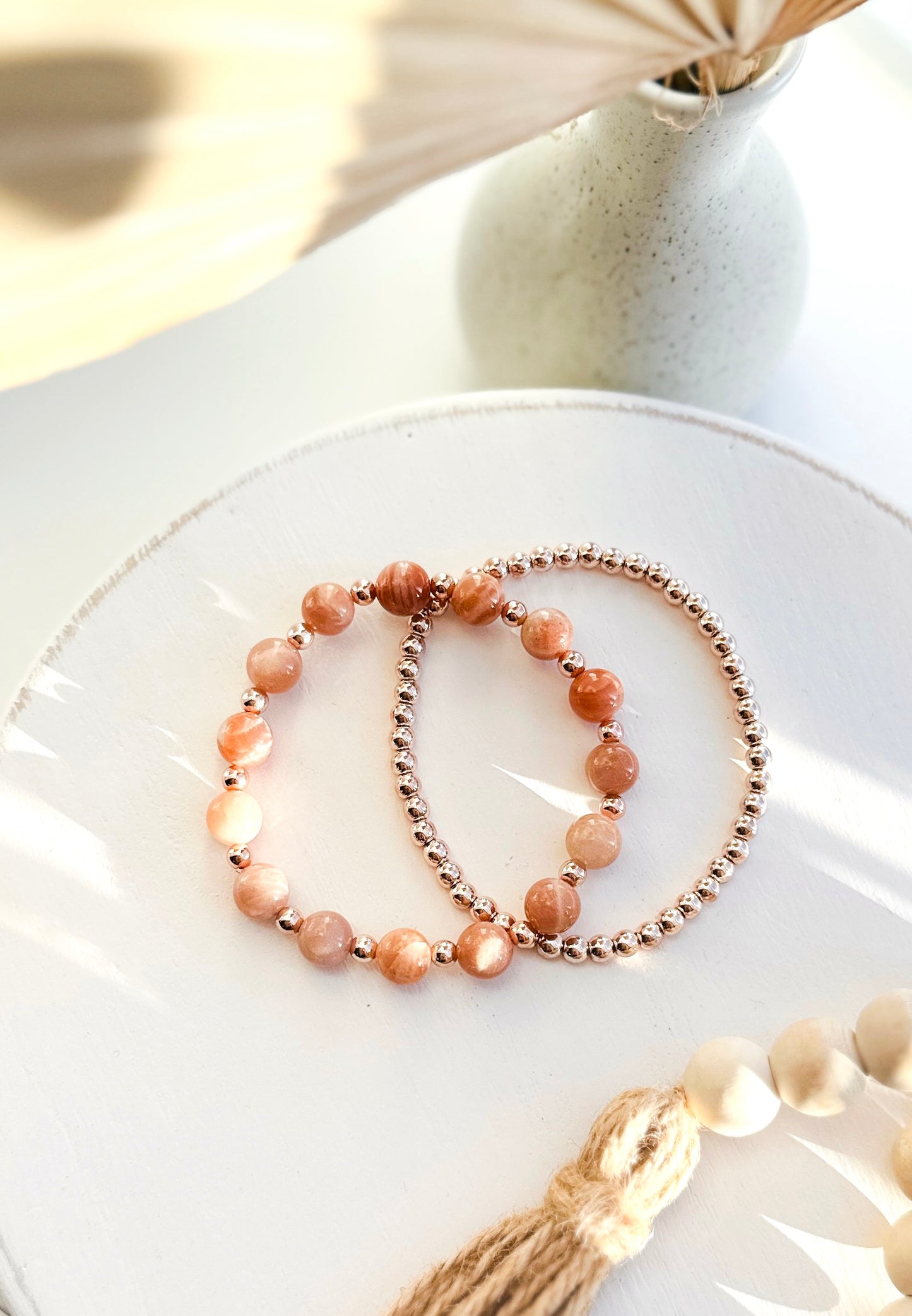 Introducing our exquisite gemstone bracelet set, crafted with the powerful energies of Sunstone and the elegance of Rose Gold Hematite.

Sunstone, known for its radiant warmth, promotes joy, vitality, and personal power. Complementing this, Rose Gold Hematite is believed to bring balance, grounding, and a sense of tranquility.

