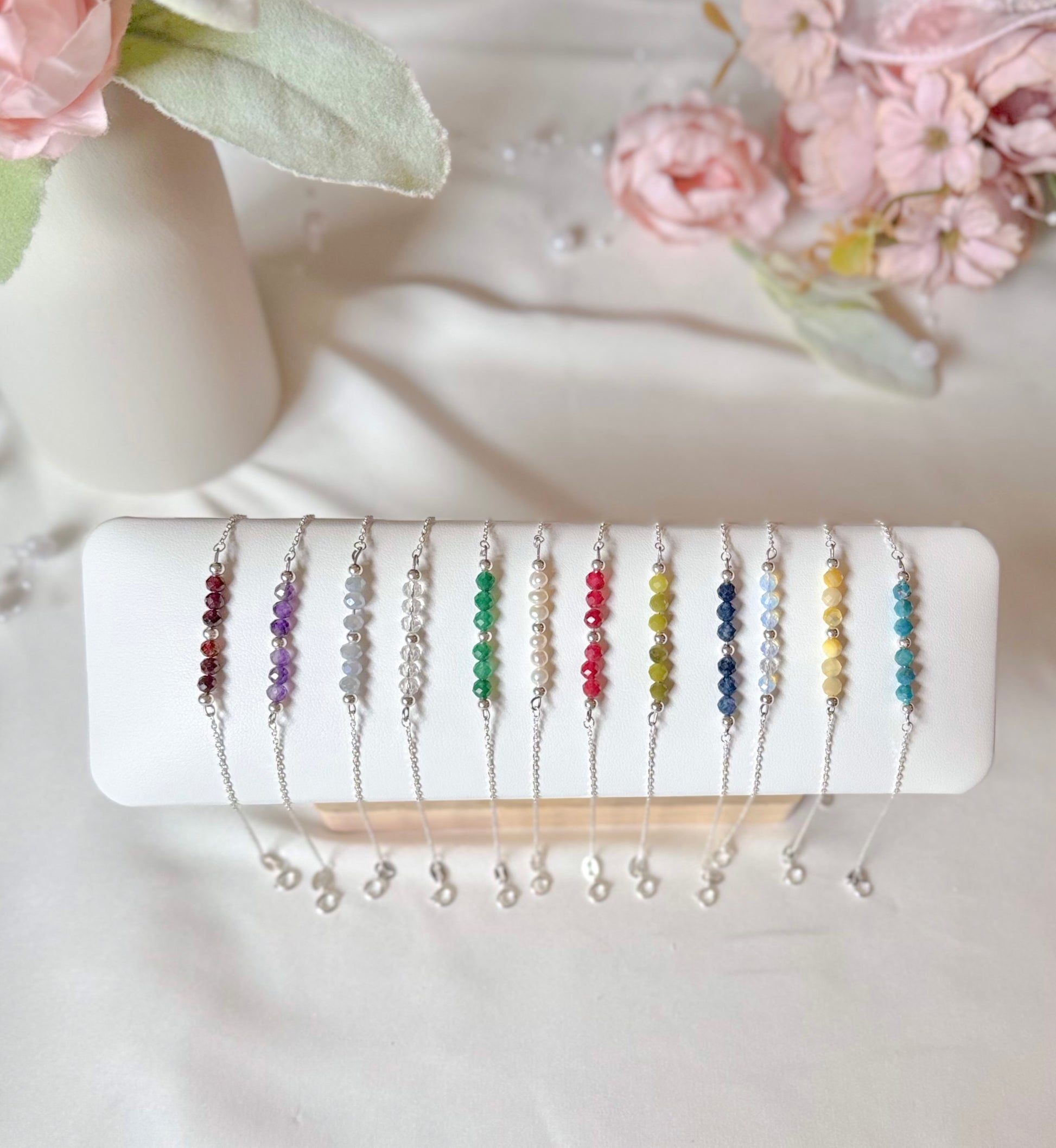 A sparkly new addition to the Manifestation Collection featuring various birthstone gemstones like Amethyst, Emerald, and Sapphire. High-quality aesthetic jewelry for spiritual manifesting and birthday gifting."
