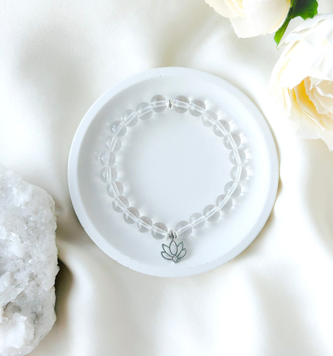  the "Luminescent Lotus Bracelet," a sublime fusion of Clear Quartz and a Lotus charm, 