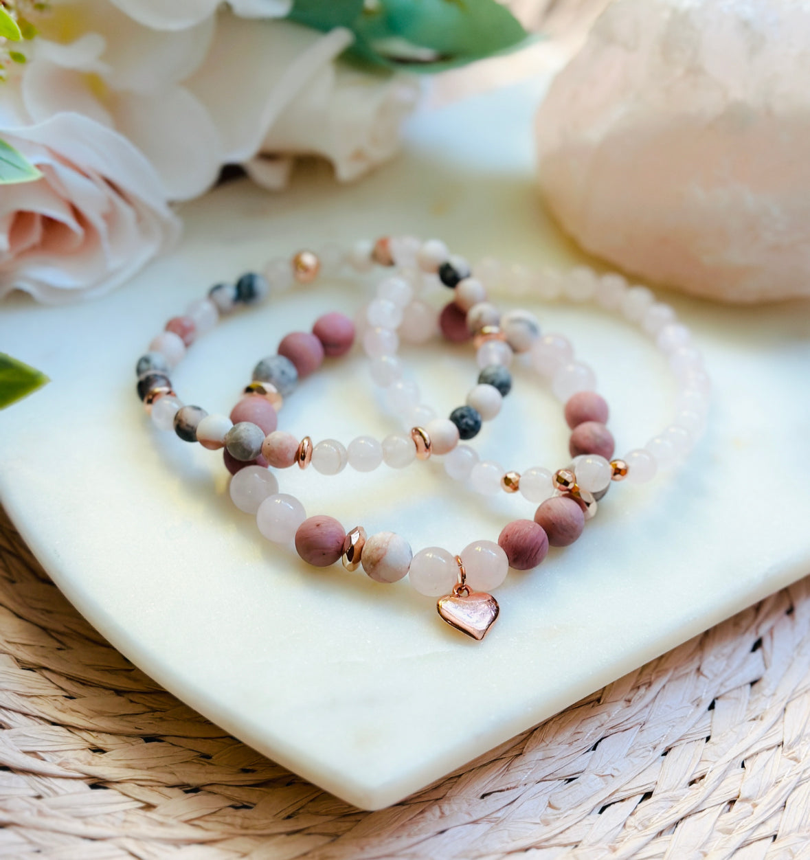 pink gemstone stacking bracelet set with rose quartz, rhodonite, pink zebra jasper and a rose gold heart charm