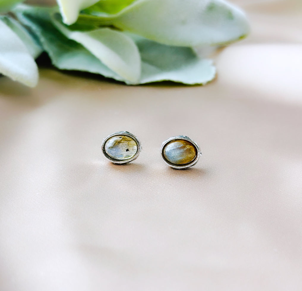 Elevate your style with these Labradorite gemstone stud earrings, expertly set in sterling silver. Beyond their captivating aesthetic appeal, these earrings carry beautiful healing properties.