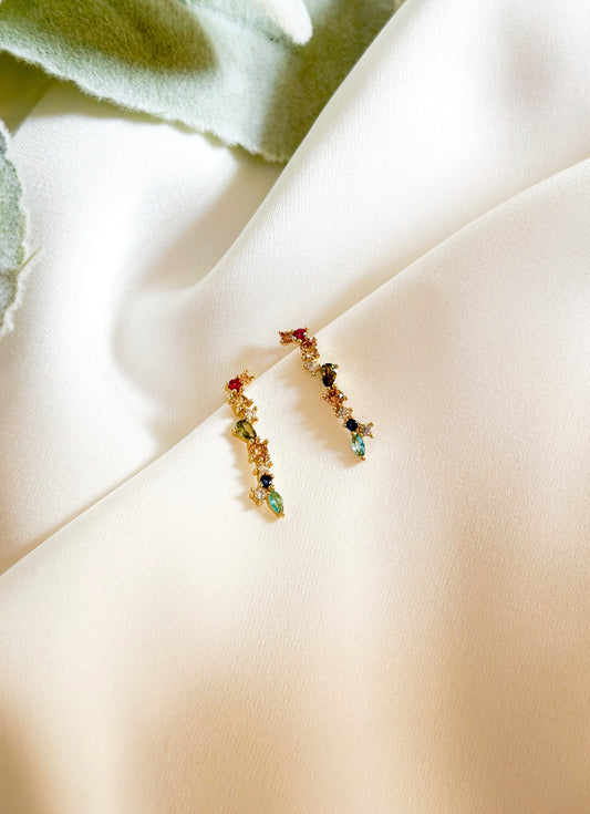 "The Eden" Sterling Silver 18k Gold Plated Multicolored Gemstone Earrings, an exquisite blend of elegance and enchantment. Inspired by the lush beauty of the mythical garden, each earring is meticulously crafted to evoke the vibrant hues and timeless allure of paradise.