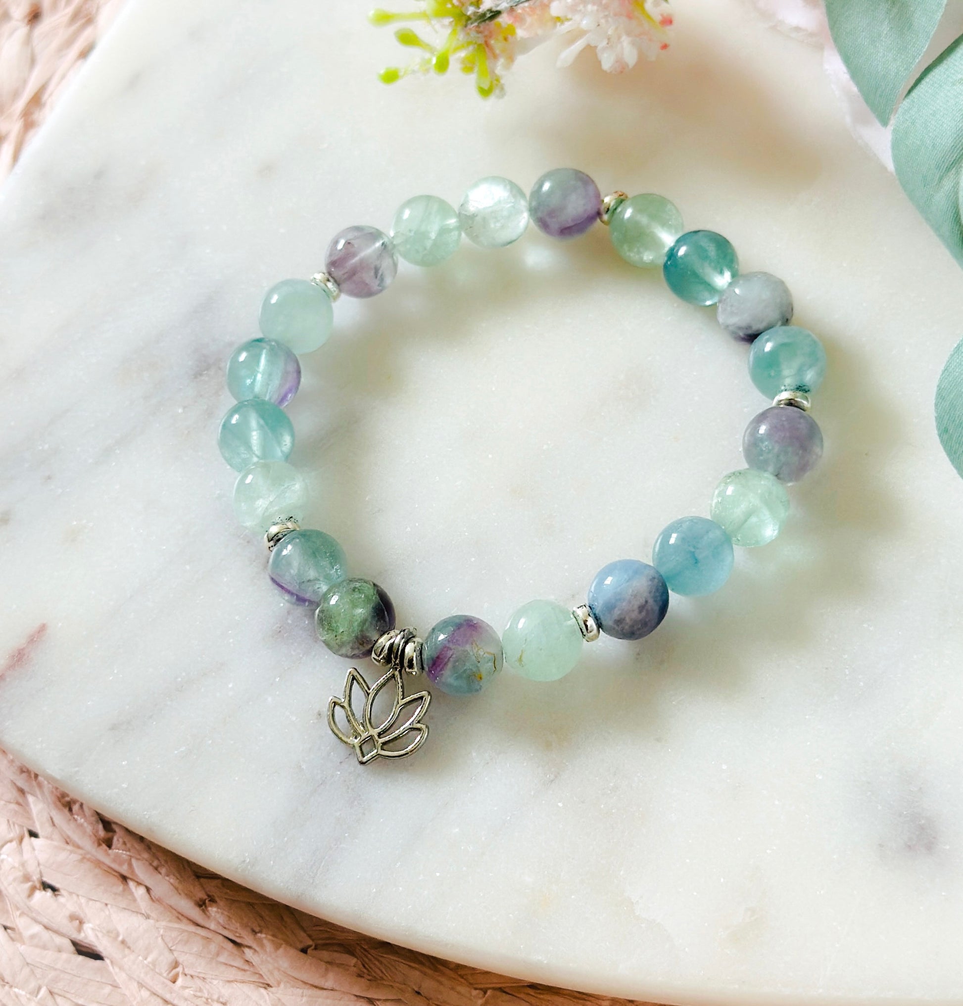 Fluorite gemstone bracelet with a lotus charm