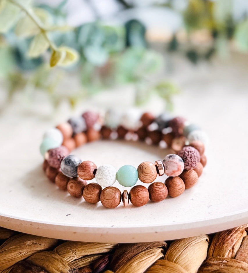 Gemstone stacking bracelets for energy grounding created with Pink Zebra Jasper, Amazonite, Lava Rock and Rosewood gemstone beads diffuser bracelets