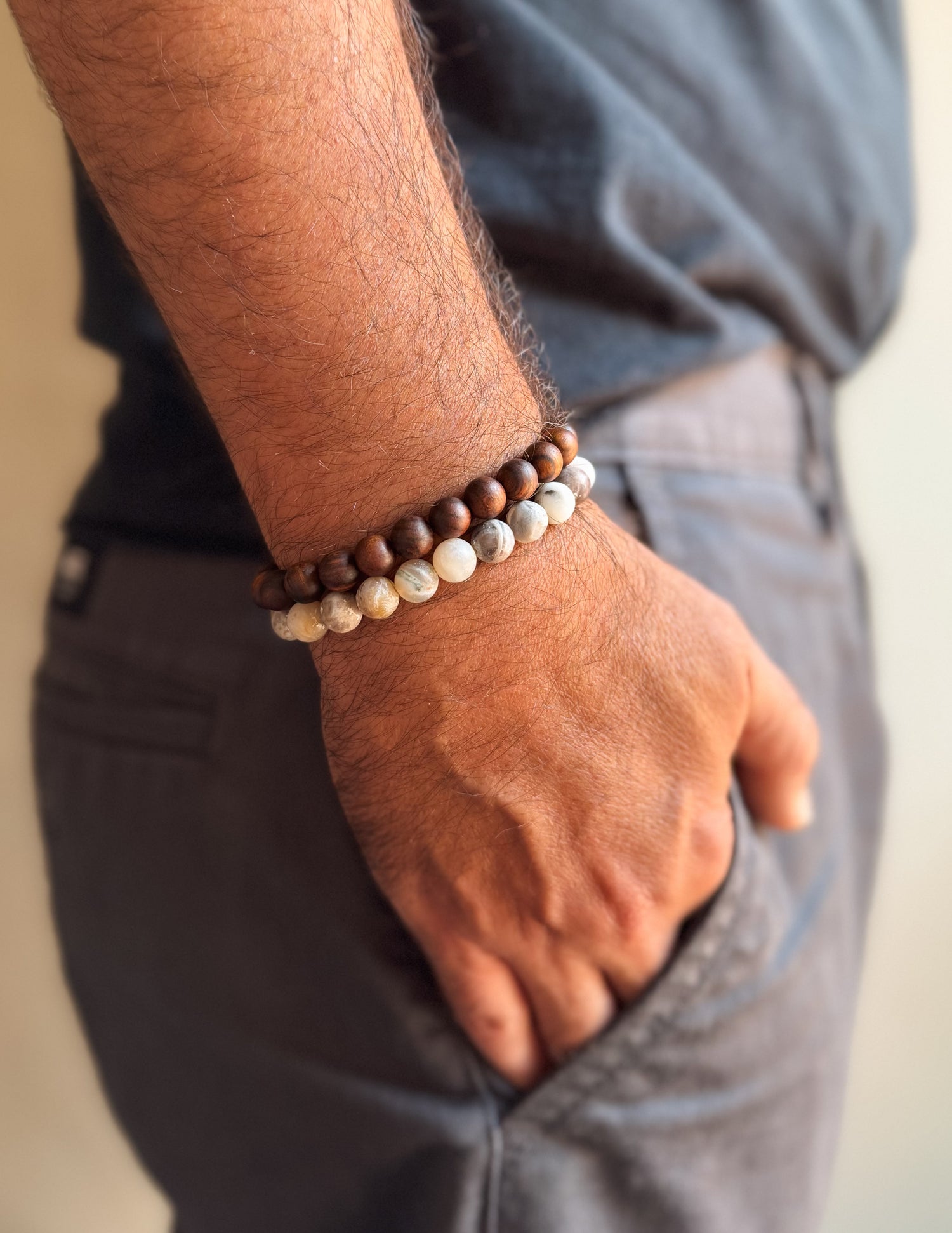 Person wearing a beaded bracelet on a blurred background. Fathers Day Collection gemstone bracelets canada