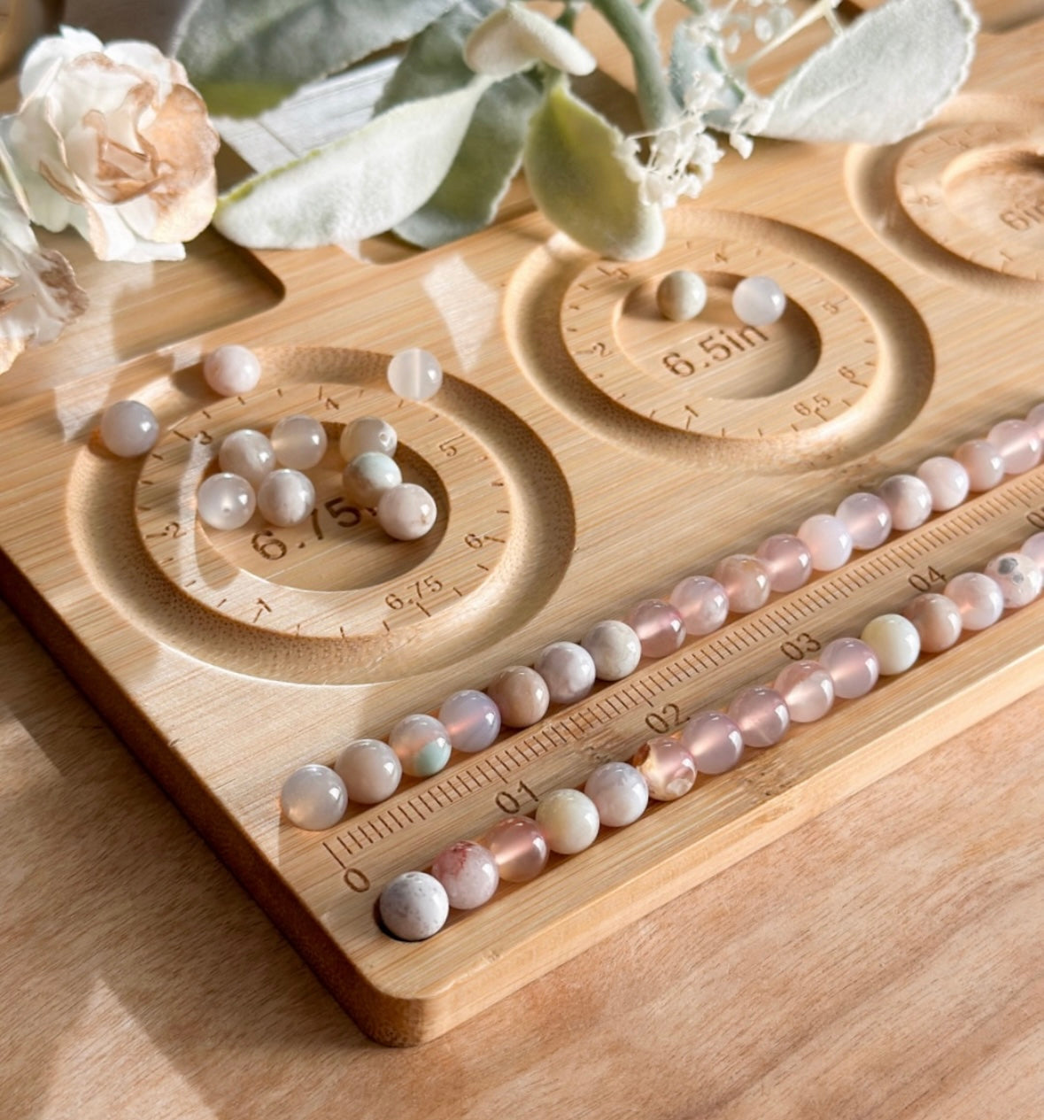 Wooden bracelet measuring board with authentic gemstones for creating bracelets 